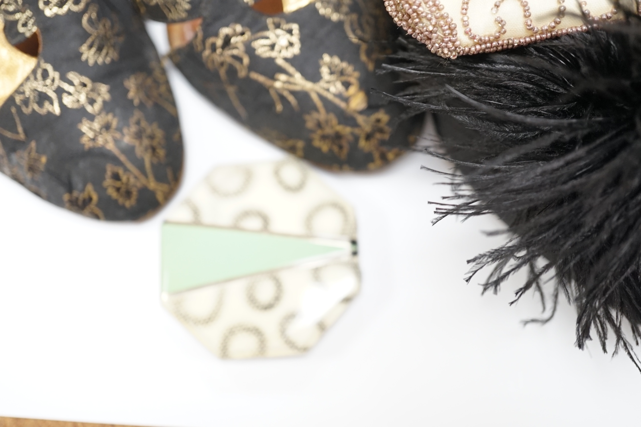 A pair of ladies black feather decorated 1940’s evening shoes, a similar gold leather and brocade pair of shoes, with a collection of bead bags, compacts, etc.
